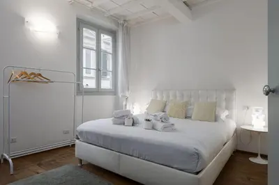 Letto o letti in una camera di UNYCA - Santa Croce Florence Apartment