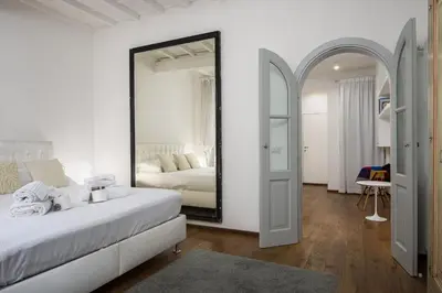 Letto o letti in una camera di UNYCA - Santa Croce Florence Apartment