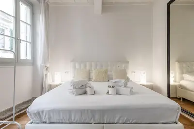 Letto o letti in una camera di UNYCA - Santa Croce Florence Apartment