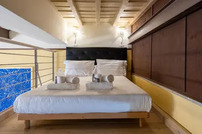 Letto o letti in una camera di UNYCA - Florence Central Loft