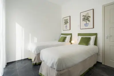 Letto o letti in una camera di Rinascimento Apartments
