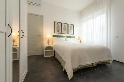 Letto o letti in una camera di Rinascimento Apartments