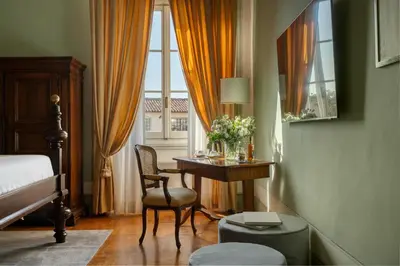 Letto o letti in una camera di Loggiato Dei Serviti