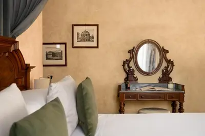 Letto o letti in una camera di Loggiato Dei Serviti