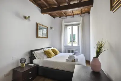 Letto o letti in una camera di Family Apartment in Oltrarno Florence