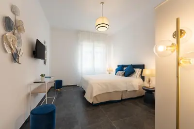 Letto o letti in una camera di Rinascimento Apartments