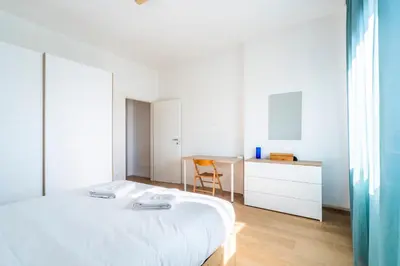 Letto o letti in una camera di NEW 2BDR - Attico Panoramico con Posto Auto
