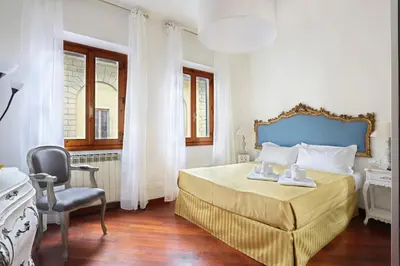 Letto o letti in una camera di L&D 51 LUXURY SUITES, Ognissanti square