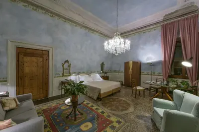 Letto o letti in una camera di Torre dei Lari Residenza d'Epoca