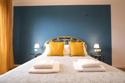 Letto o letti in una camera di Wine Apartments Florence Cabernet