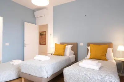 Letto o letti in una camera di Wine Apartments Florence Cabernet