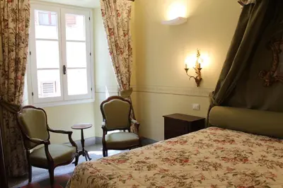 Letto o letti in una camera di Corte dei Neri Residenza d'Epoca