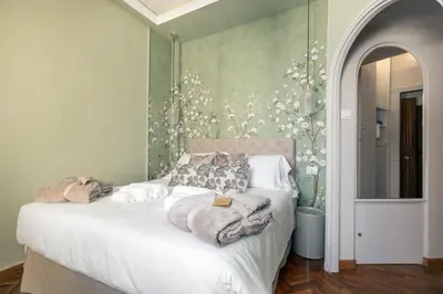 Letto o letti in una camera di Magnolia Suite by Maison Florence