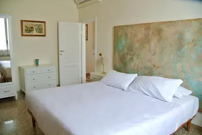Letto o letti in una camera di Vintage Petrella relax e atmosfera fiorentina
