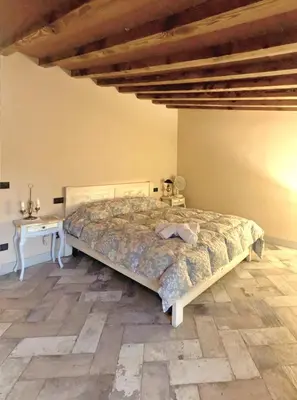 Letto o letti in una camera di Bioagriturismo Podere Ruggeri