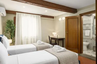 Letto o letti in una camera di Vibe Florence - Via della Chiesa 51