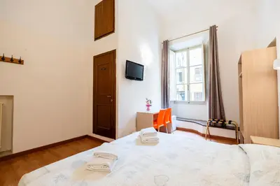 Letto o letti in una camera di Duomo Rooms Florence by Hôtea
