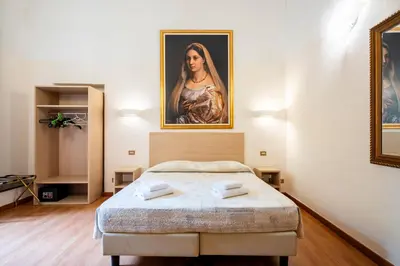 Letto o letti in una camera di Duomo Rooms Florence by Hôtea