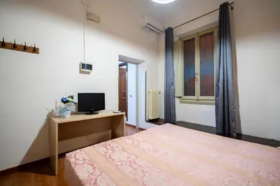 Letto o letti in una camera di Duomo Rooms Florence by Hôtea