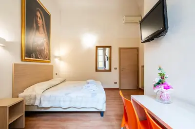 Letto o letti in una camera di Duomo Rooms Florence by Hôtea