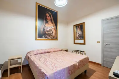 Letto o letti in una camera di Duomo Rooms Florence by Hôtea