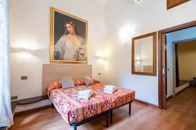 Letto o letti in una camera di Duomo Rooms Florence by Hôtea
