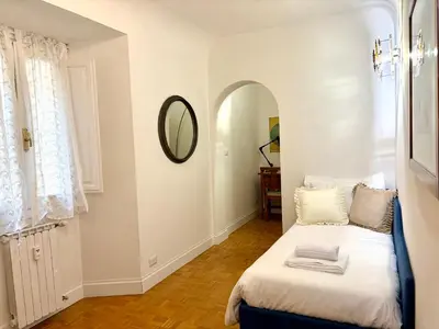 Letto o letti in una camera di Casa D'Azeglio, central Florence, quiet and elegant