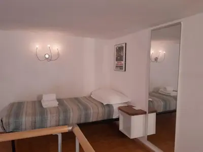 Letto o letti in una camera di Casa De Verdi loft panoramico