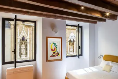 Letto o letti in una camera di Orsanmichele Suite