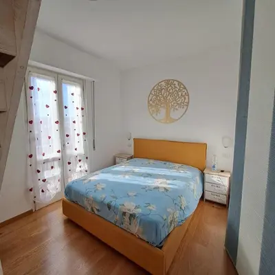 Letto o letti in una camera di Attico Il Giglio di Firenze