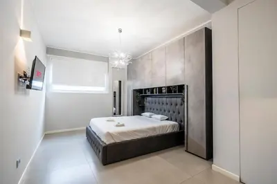 Letto o letti in una camera di NEW - 2 Min Metro Batoni - Luxury Apt con Posto Auto