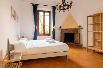Letto o letti in una camera di Eventi e Relax vicino allo stadio e al Centro Storico