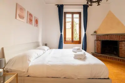 Letto o letti in una camera di Eventi e Relax vicino allo stadio e al Centro Storico