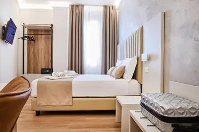 Letto o letti in una camera di Florence Medali Rooms