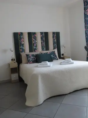 Letto o letti in una camera di L'attico Rinascente
