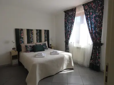 Letto o letti in una camera di L'attico Rinascente