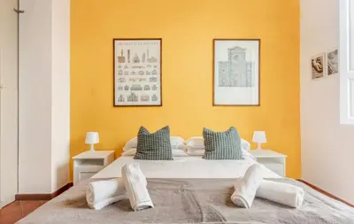 Letto o letti in una camera di Indipendenza Flat