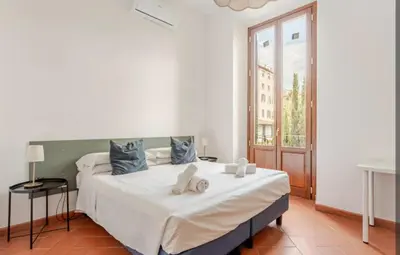 Letto o letti in una camera di Indipendenza Flat