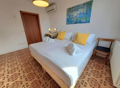 Letto o letti in una camera di Leone Flat