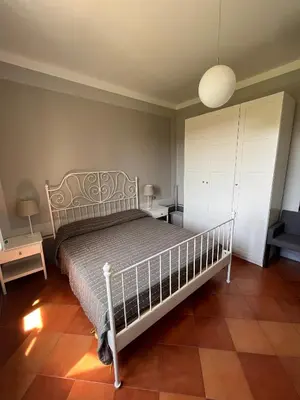 Letto o letti in una camera di Toscana in Città - Silenzioso APT immerso nella natura