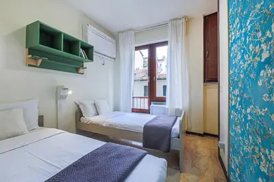 Letto o letti in una camera di Apartments Florence- Kaleidos