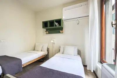 Letto o letti in una camera di Apartments Florence- Kaleidos