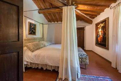 Letto o letti in una camera di Villa Riflessi di Fiesole - Piscina - Vista Firenze