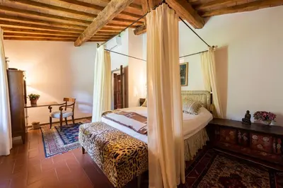 Letto o letti in una camera di Villa Riflessi di Fiesole - Piscina - Vista Firenze