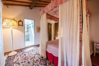 Letto o letti in una camera di Villa Riflessi di Fiesole - Piscina - Vista Firenze