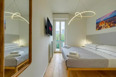 Letto o letti in una camera di BellaVita Boutique Florence
