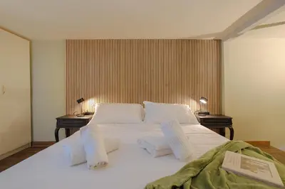 Letto o letti in una camera di Sant'Ambrogio Oasis Apartment
