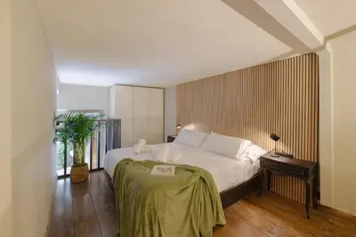 Letto o letti in una camera di Sant'Ambrogio Oasis Apartment