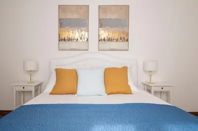 Letto o letti in una camera di Tra Duomo e Uffizi Appartamenti moderni nel cuore dell'arte