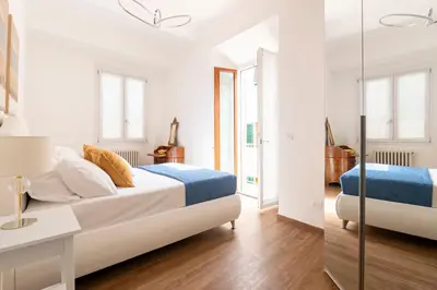 Letto o letti in una camera di Tra Duomo e Uffizi Appartamenti moderni nel cuore dell'arte